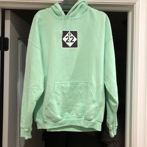 Green sherbet M22 hoodie. Logo on front, back and hood.